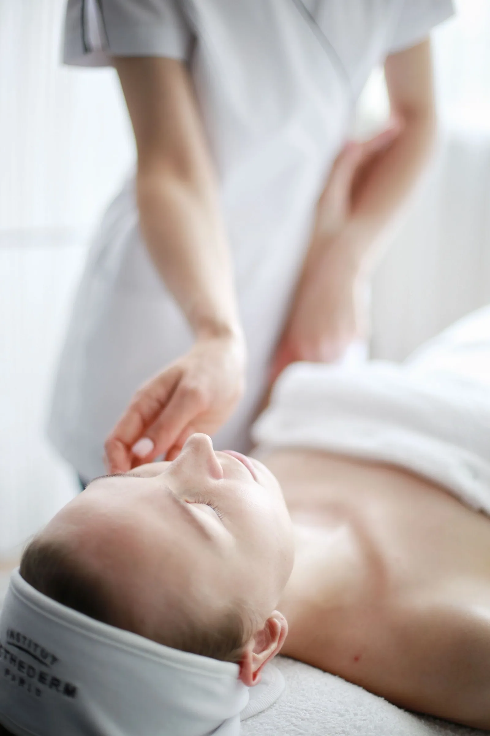 A therapist using gentle touch during a quiet treatment